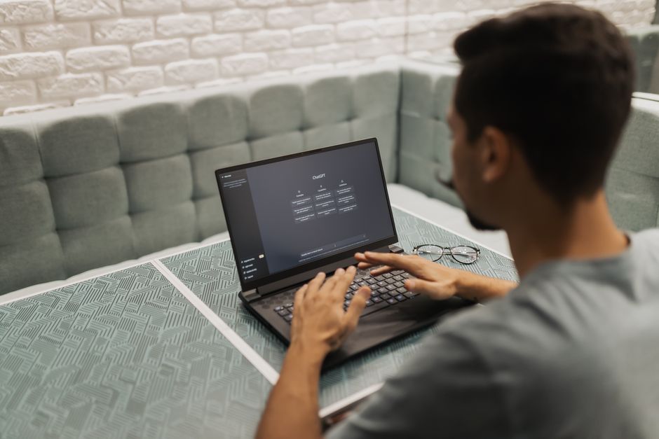 Person using Claude AI on a laptop to make money online