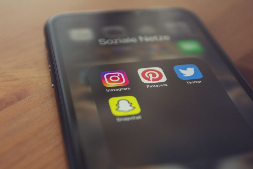 TikTok ads vs Facebook ads comparison on smartphone