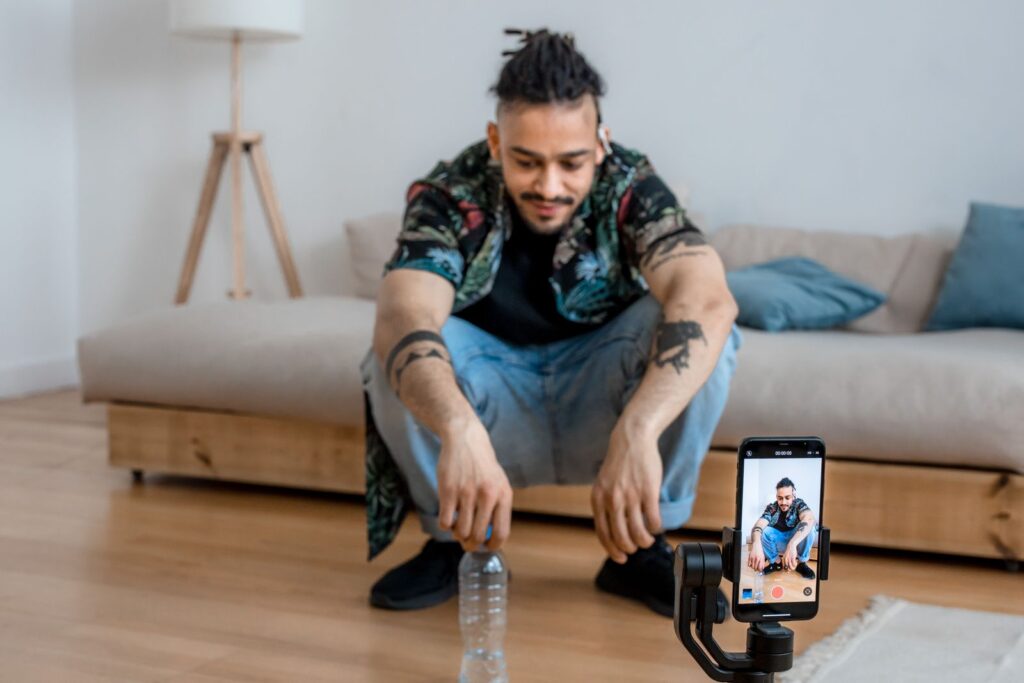 Creator recording video on a smartphone tripod, illustrating the TikTok ads course and how ad creative is made